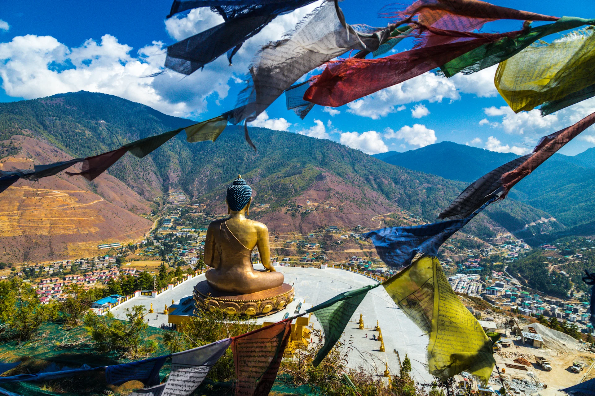 Looking across Golden Buddha statue and mountains across Bhutan.