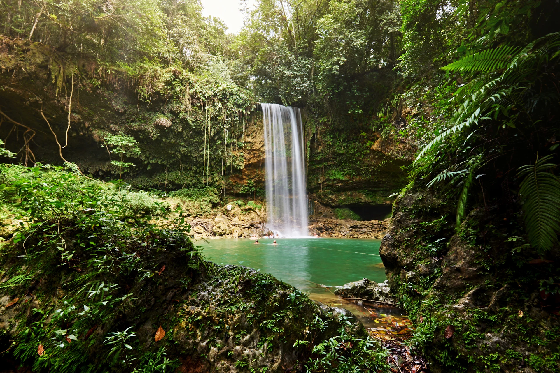Waterfall in Dominican Republic, surrounded by greenery
