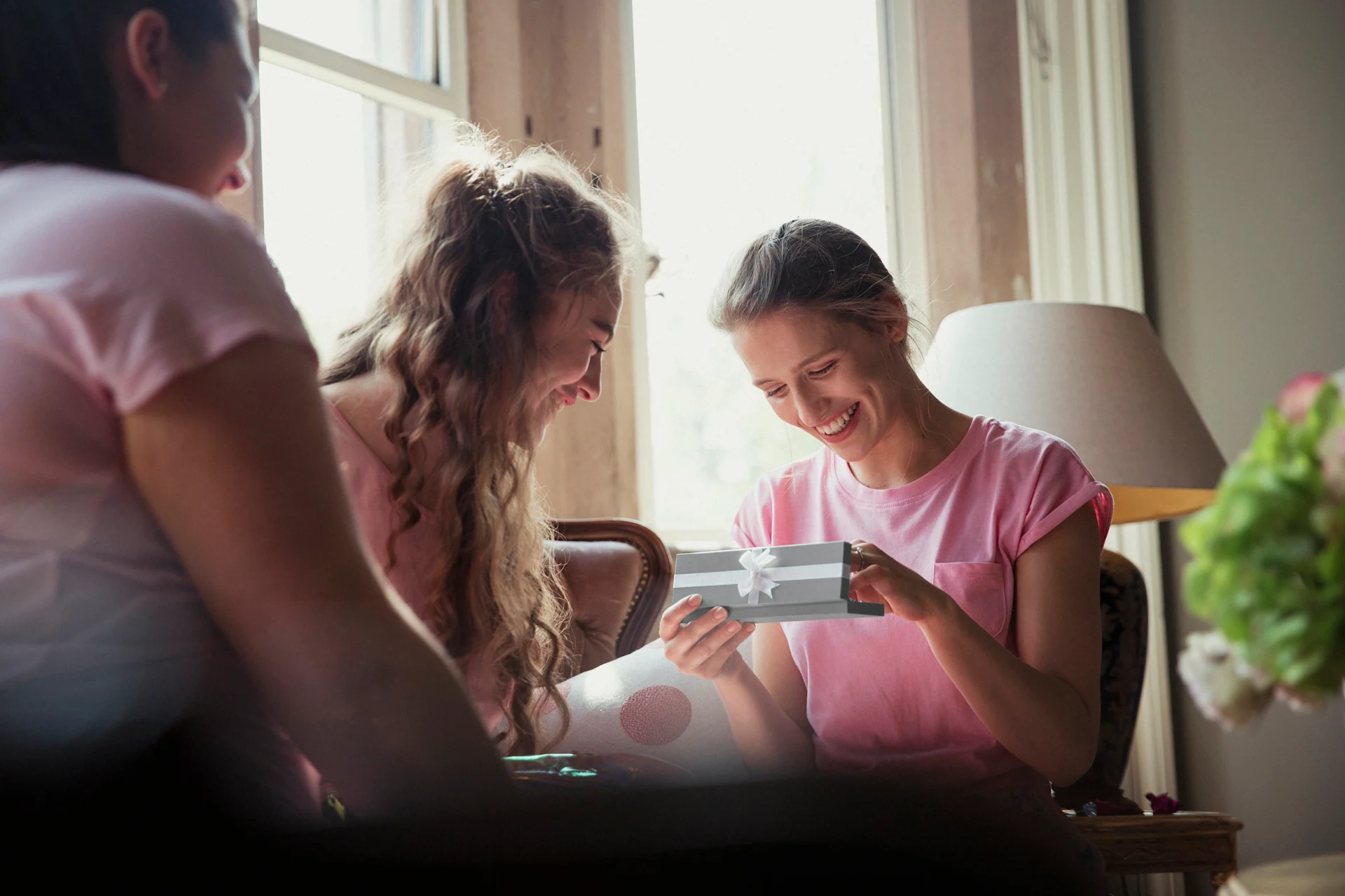 bride unwrapping gift at wedding