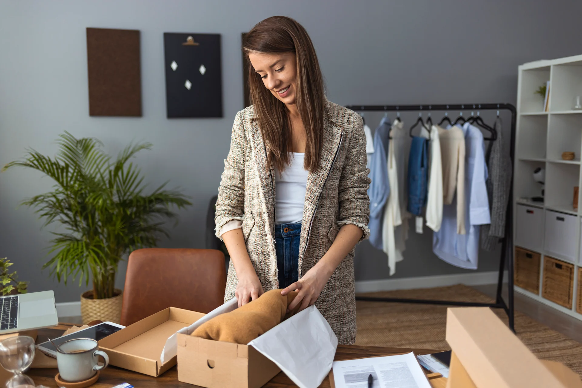 woman packing parcel for selling
