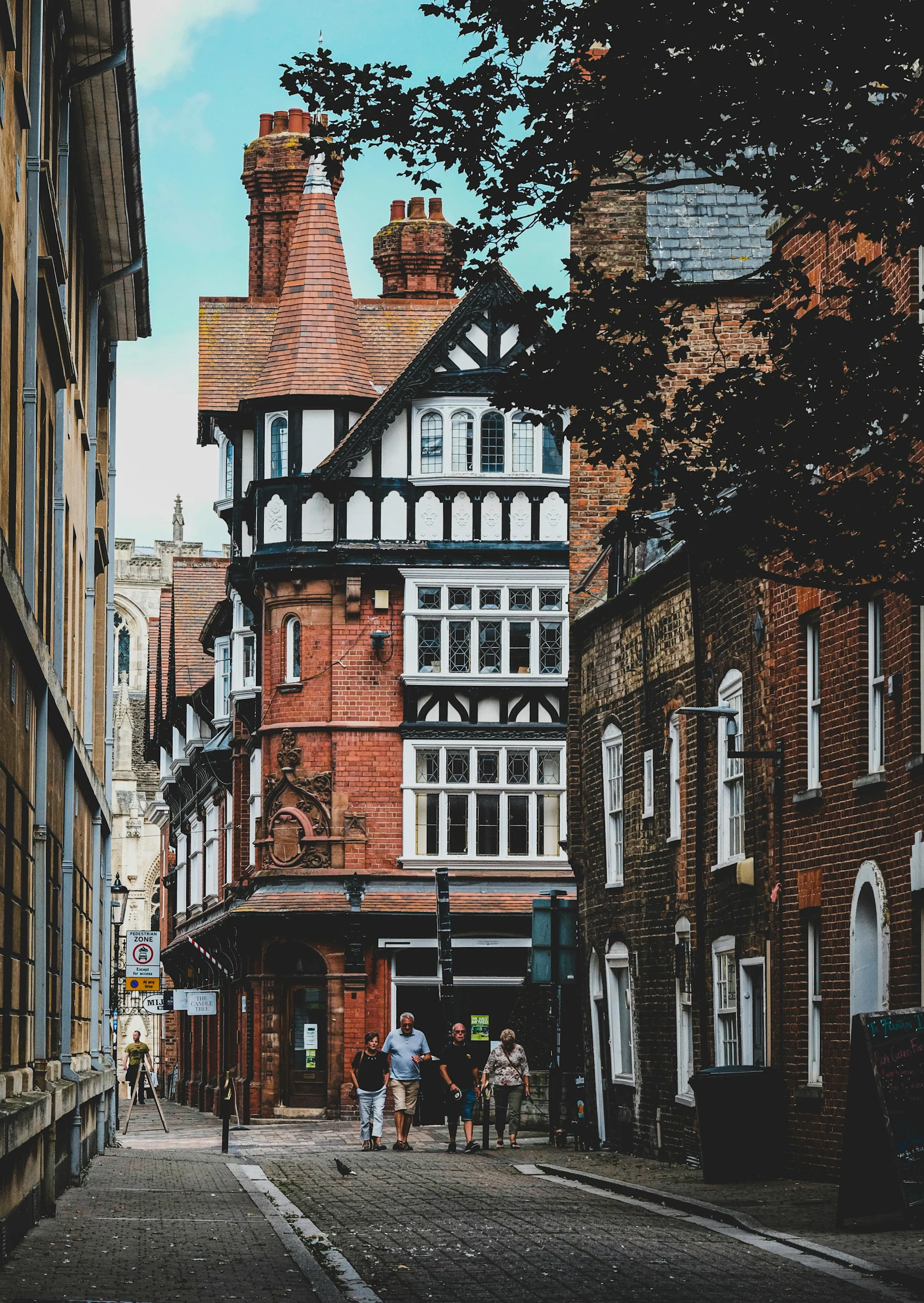 People Walking on Street with victorian style building's 