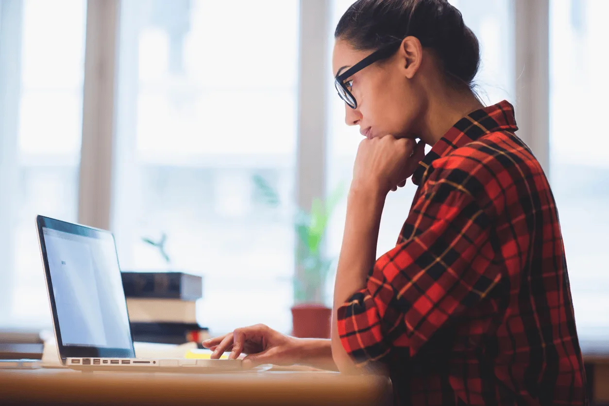 woman researching on laptop