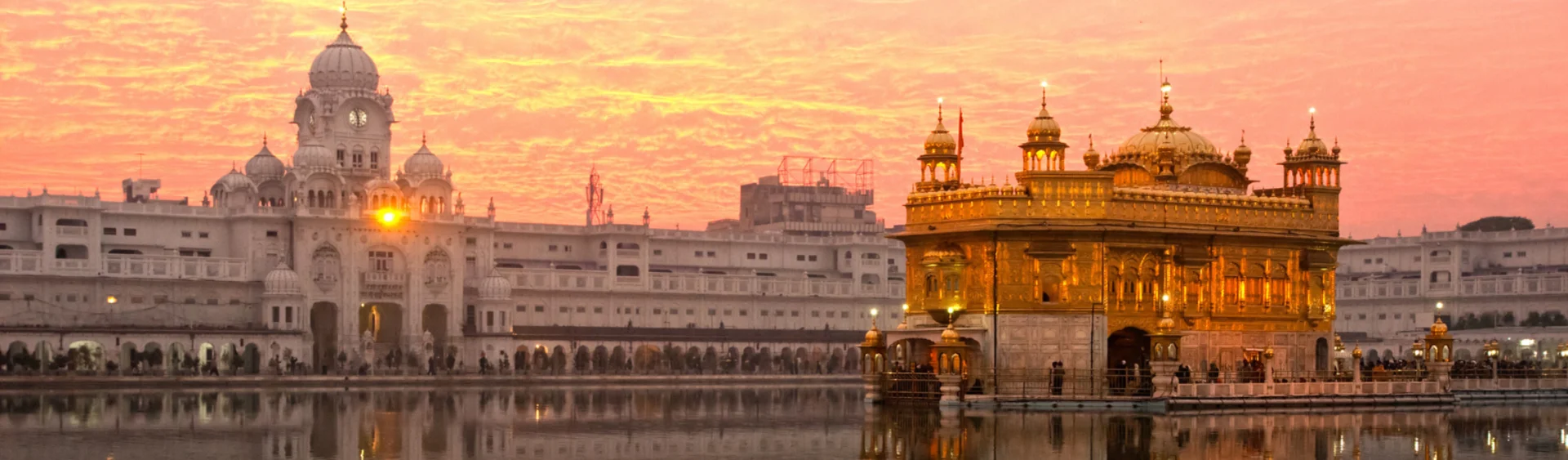 An orange evening looking across the gold temple in Punjab, India